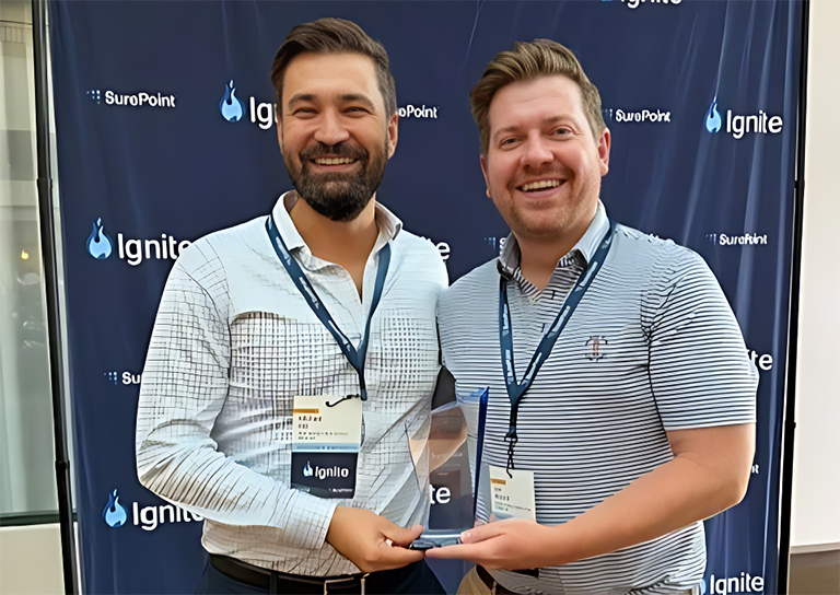 Michael Hall and Dan Minjock accepting 2026 SurePoint Ignite "Create the Future" Award